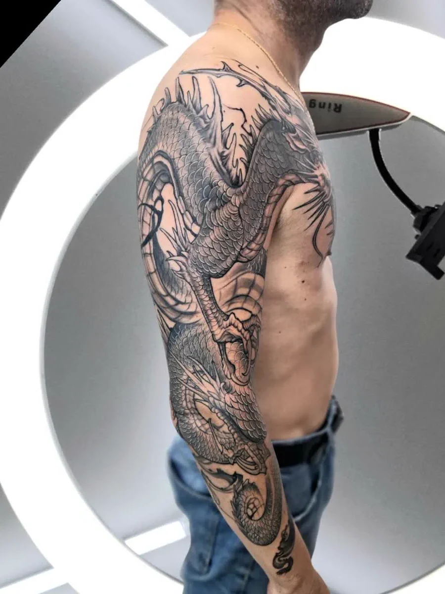 Dragon full sleeve tattoo, black and grey, Koh Samui
