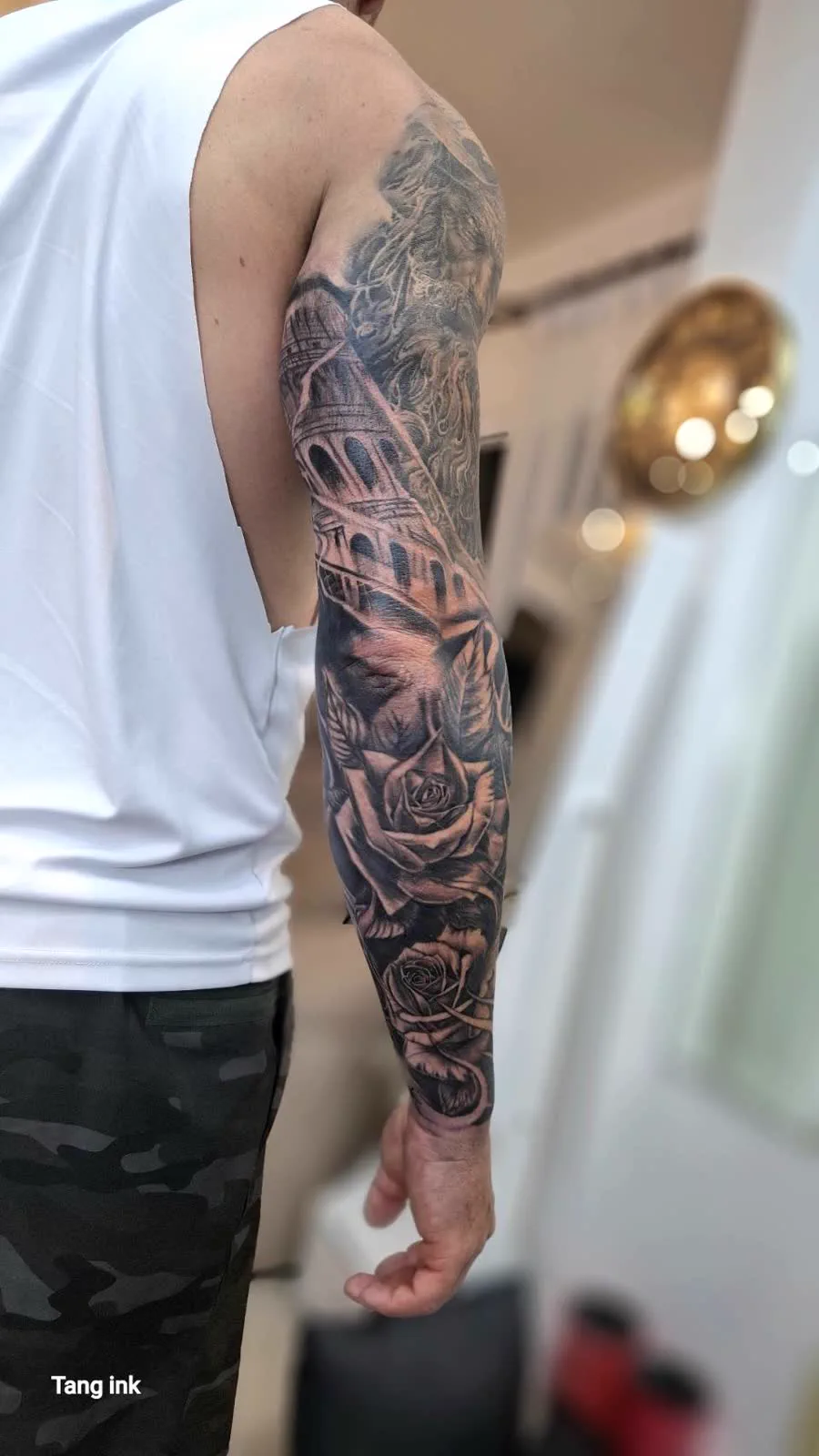 Rose and architecture full sleeve tattoo, black and grey