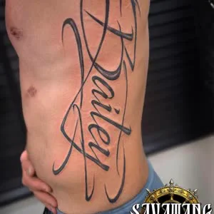 Script lettering tattoo by Savatang